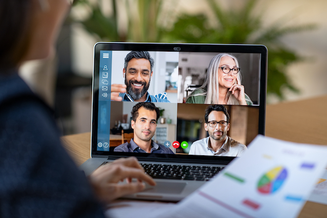 back,view,of,business,woman,talking,to,her,colleagues,about